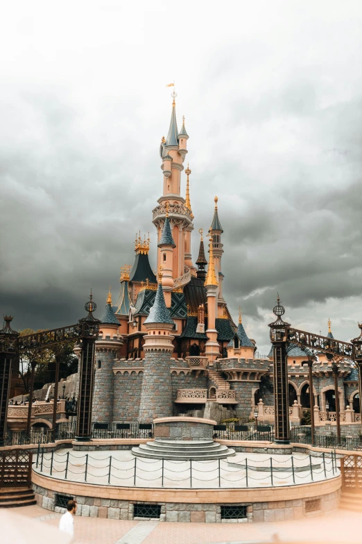 a clock tower on a cloudy day with lights