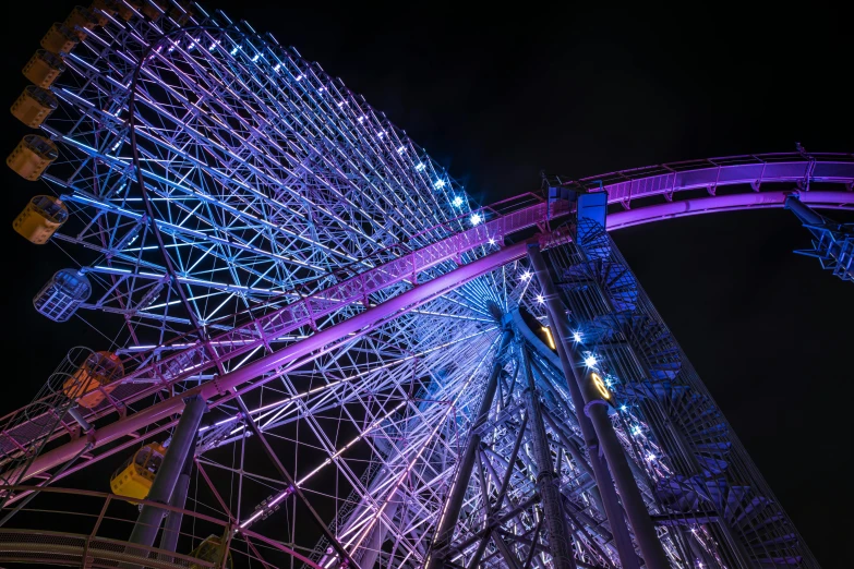 a carnival ride lit up with neon lights