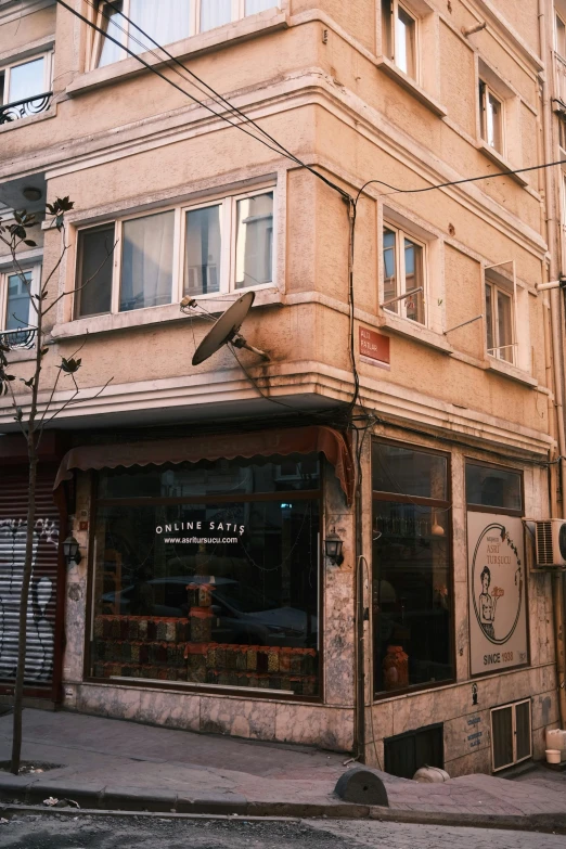 an old shop is on the corner of this street