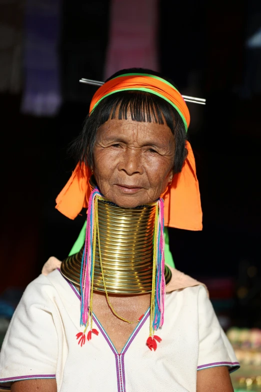 a woman with neck wear, looking at the camera