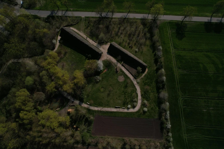 an aerial view of a green grass covered field