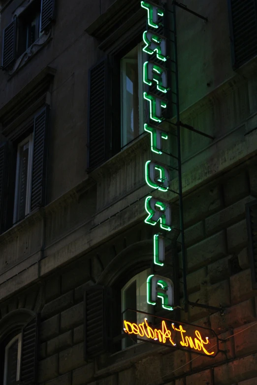 a building has neon signs that read'el california '