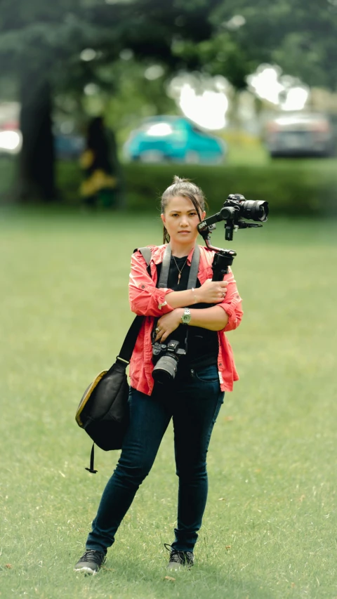 a woman with a camera holding a camera