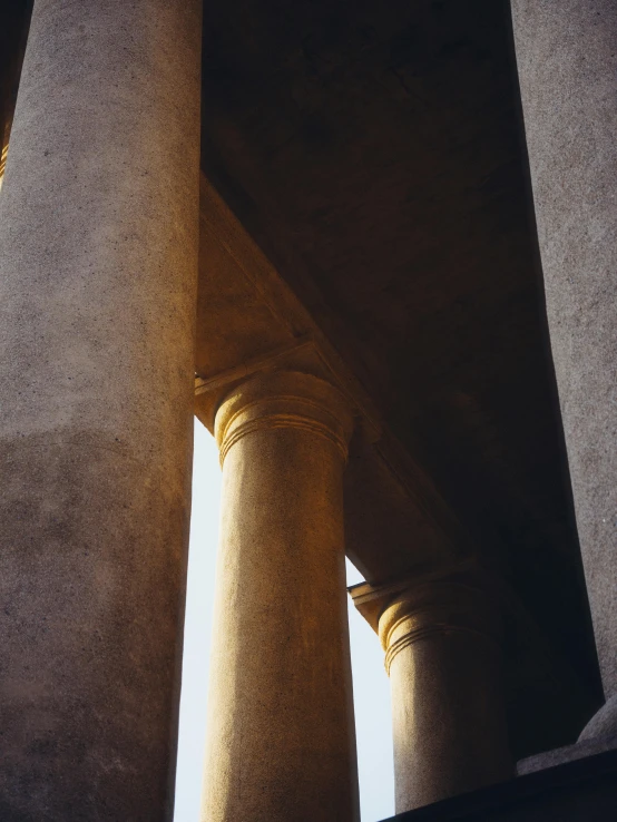 a large column is under an elevated structure