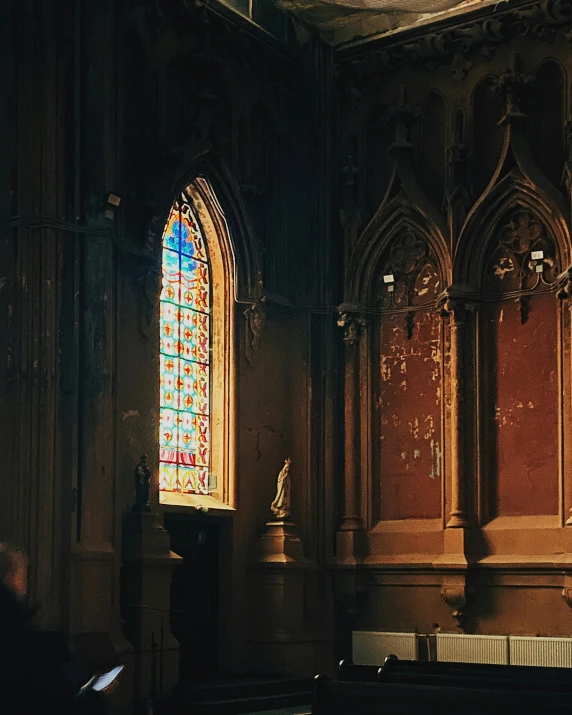 inside of an empty church with people in pews