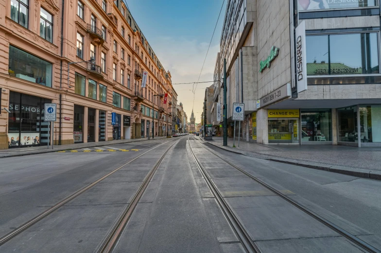 the empty street is surrounded by old buildings