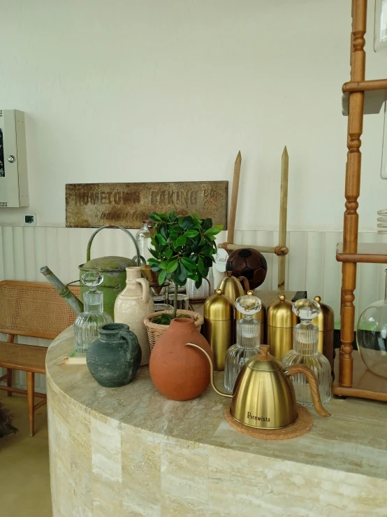 there are vases and other objects on the counter