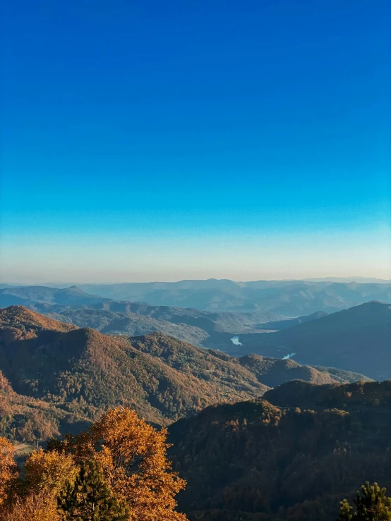 the view of mountains in the background and the clear sky