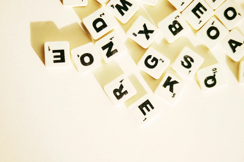 letters are shown on paper to spell out a word