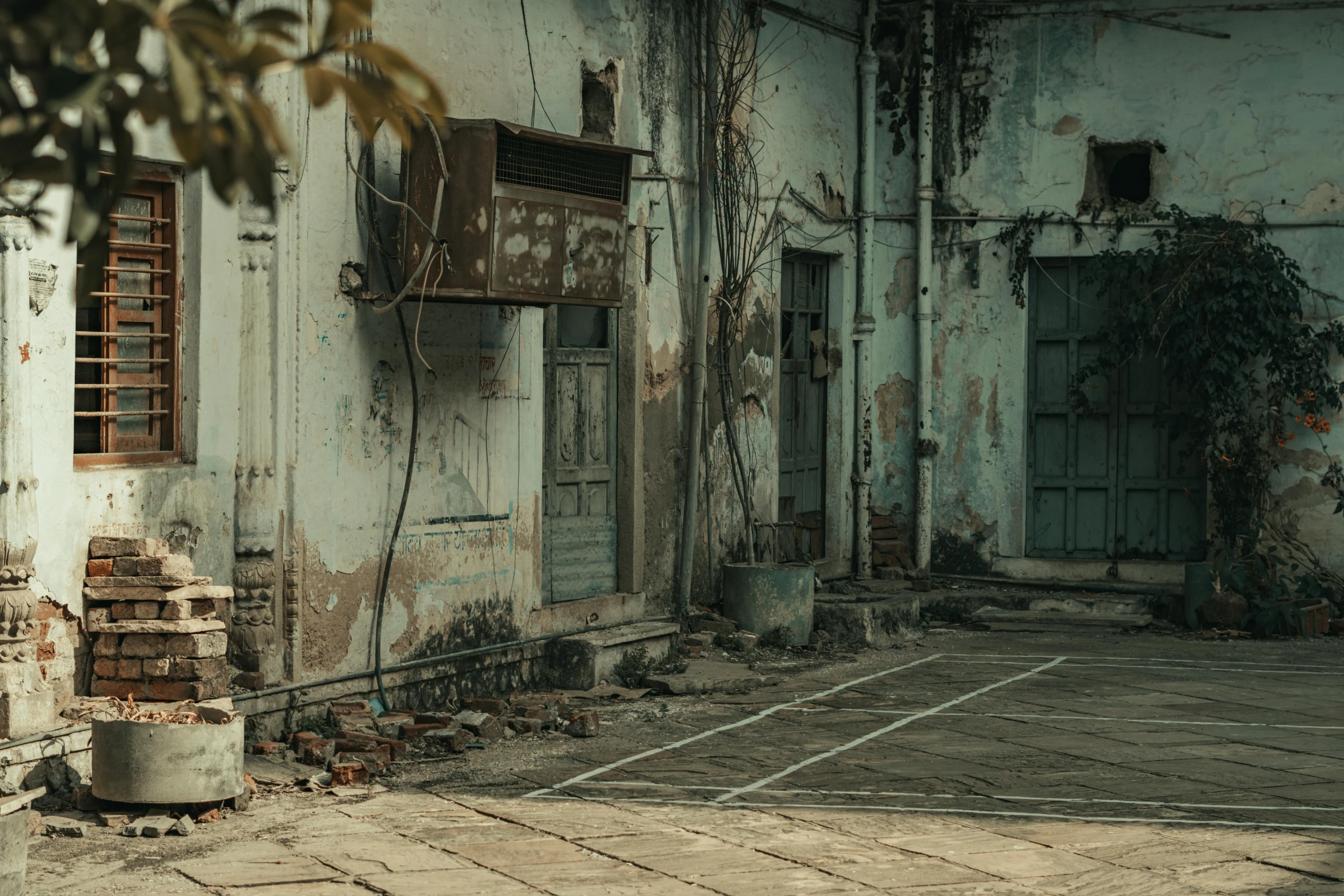 an old building with a broken down door