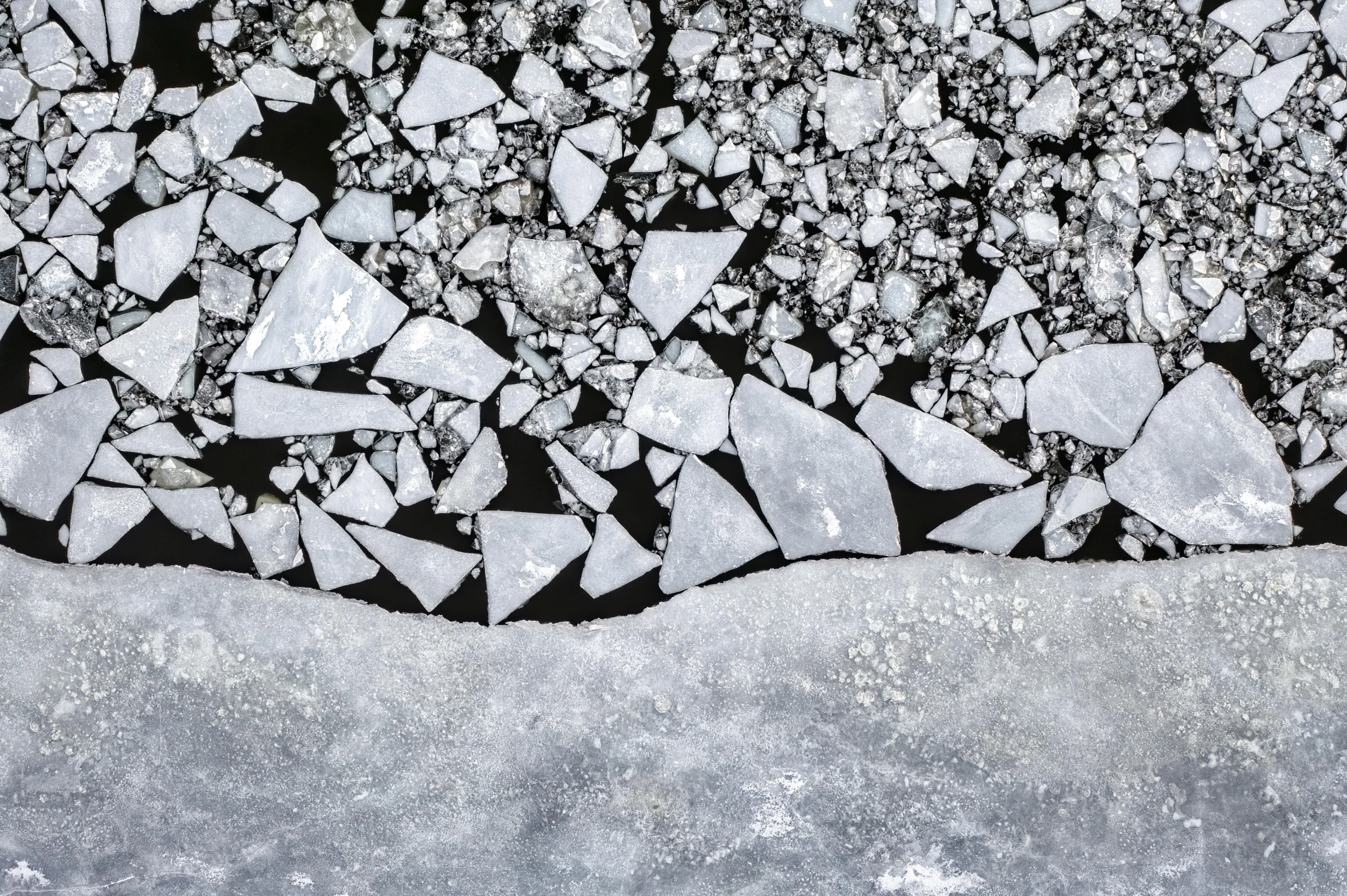 a drawing of rocks and snow against a dark background