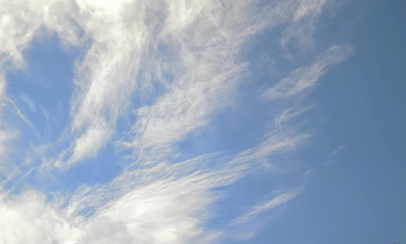 white clouds on a clear blue sky with no clouds