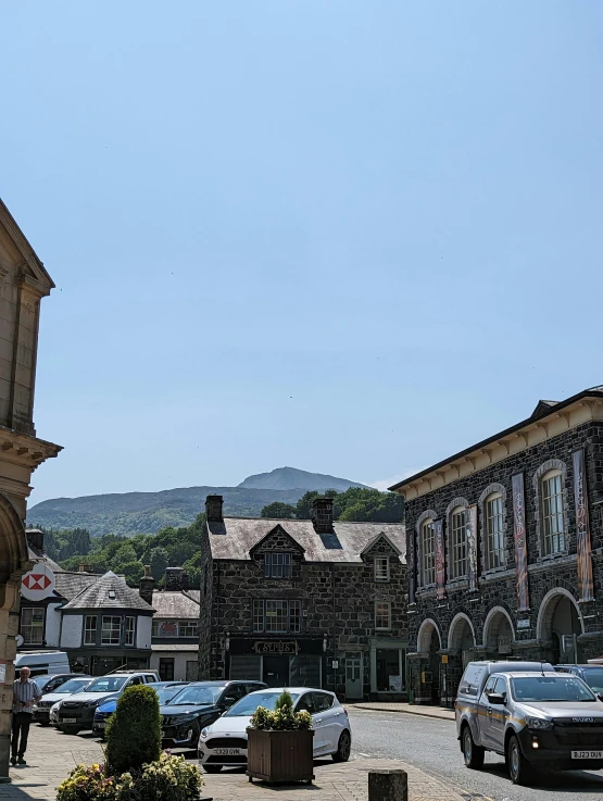 cars are parked in front of a town