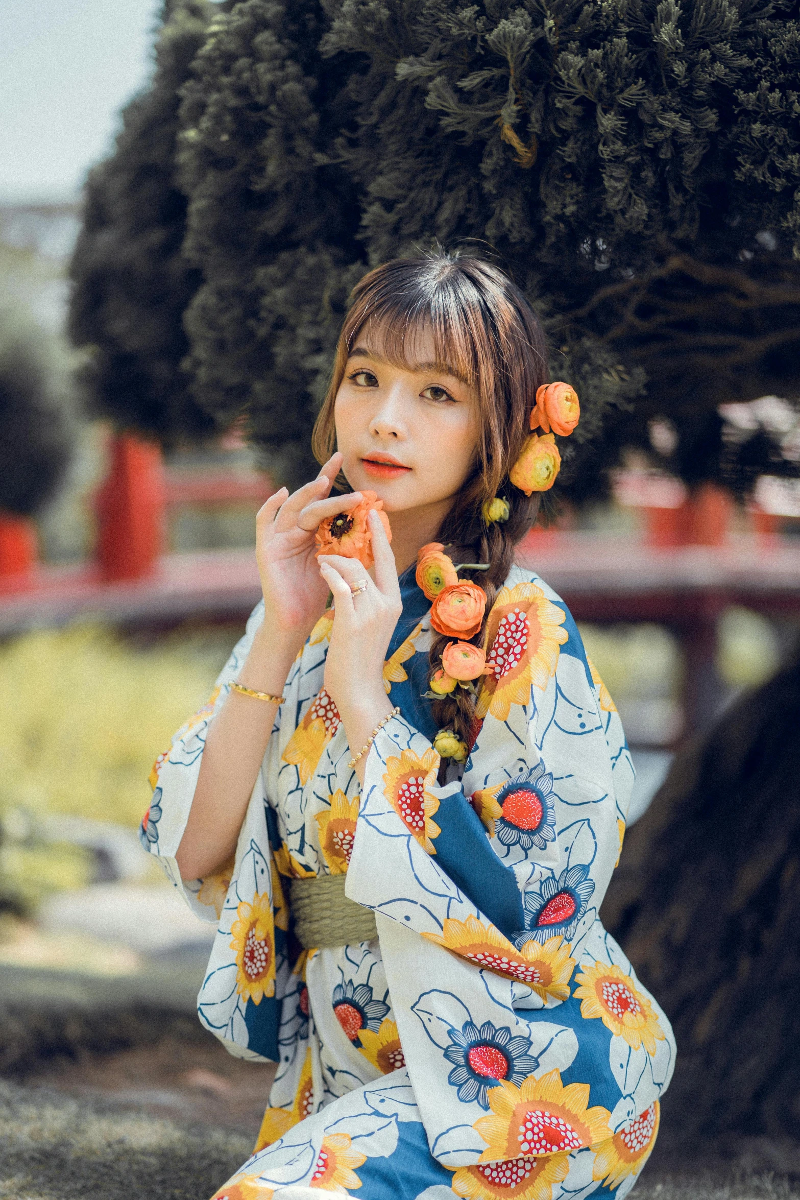 a woman dressed in an oriental garb smokes her pipe