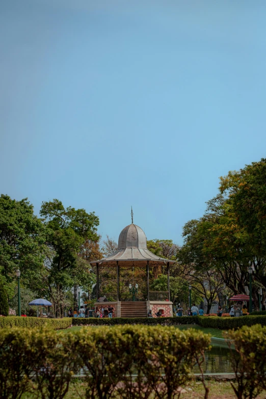 gazebo surrounded by shrubbery on the outside