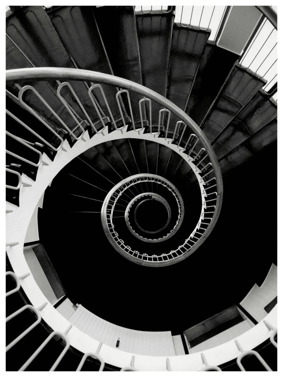 a very tall white staircase with some big stairs