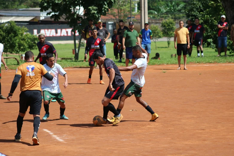 several soccer players during a soccer match in a field