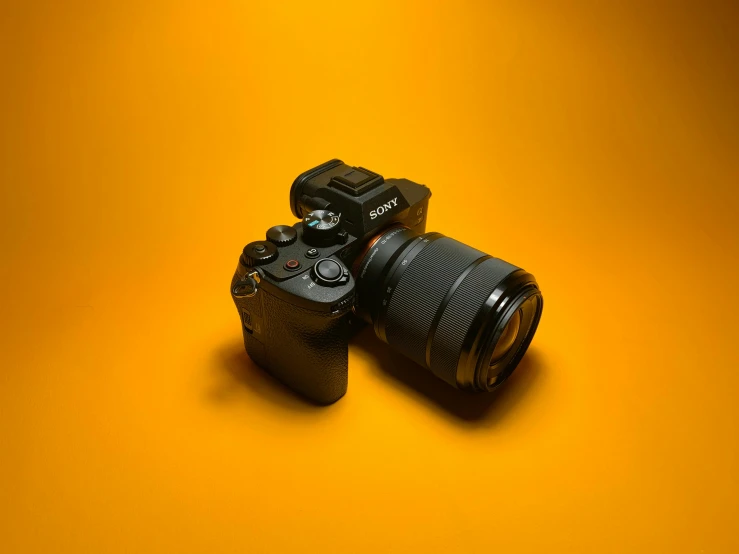 a camera set on yellow background with focus