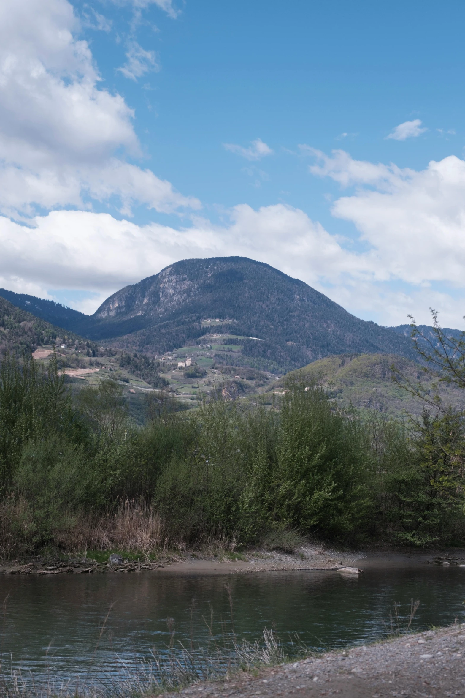 a hill with a small stream next to it