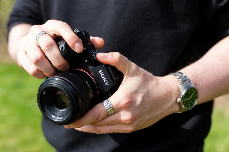 man holding out a camera to take a picture of himself