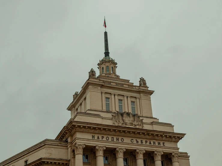 an upward view of the top of an old building