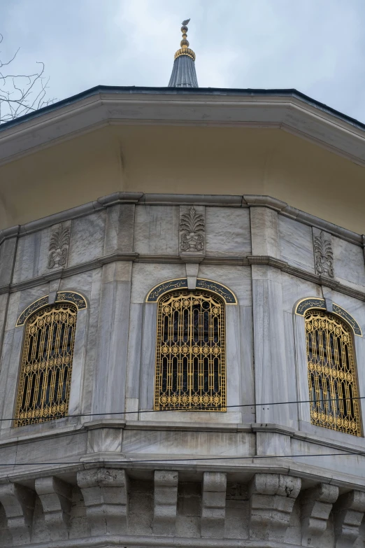 two ornate windows that are near each other