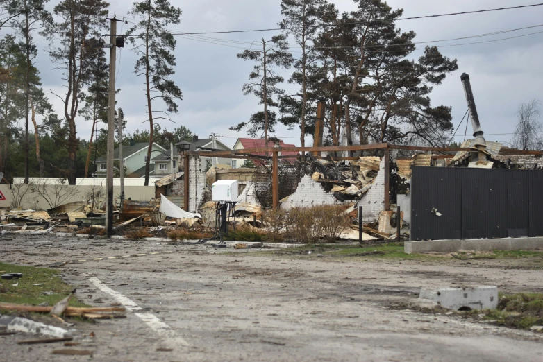 an old road in front of many houses that have been demolished