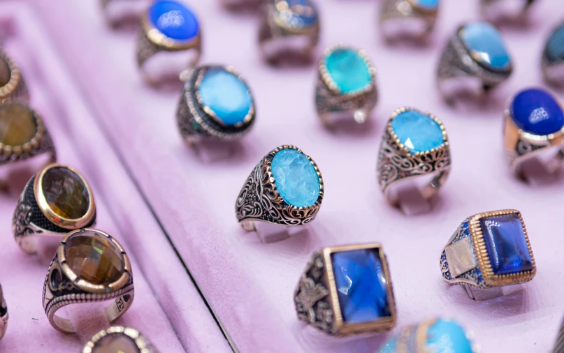 a display table with many rings and other jewelry items