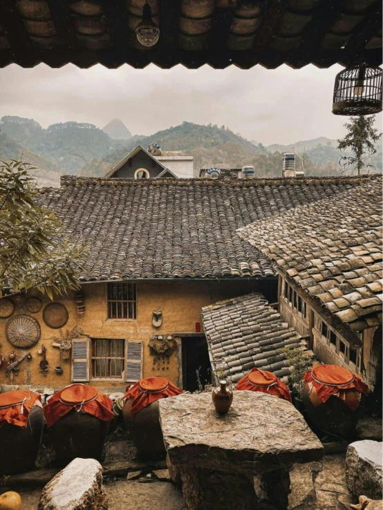 the rooftop of a home with wooden tile roofs