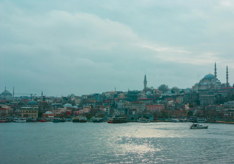 a body of water with many small boats floating on it