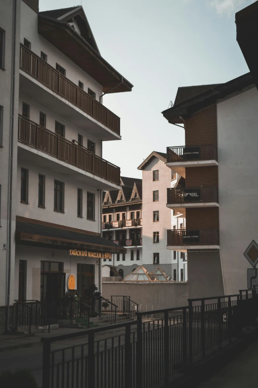 a line of buildings with balconies on top