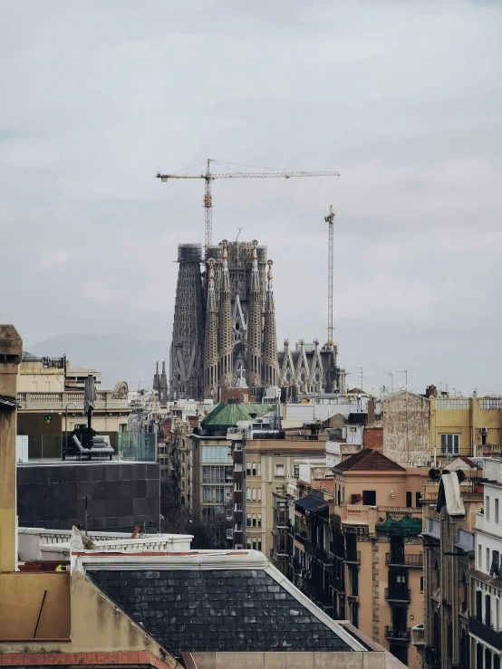 a city with tall buildings and a crane in the sky