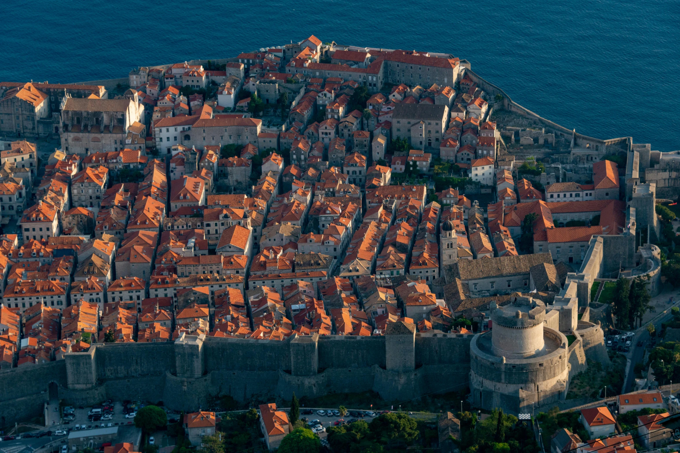 an aerial view of old houses on an island in the ocean