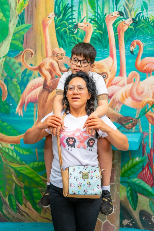 the girl is hugging her mother while she holds her purse