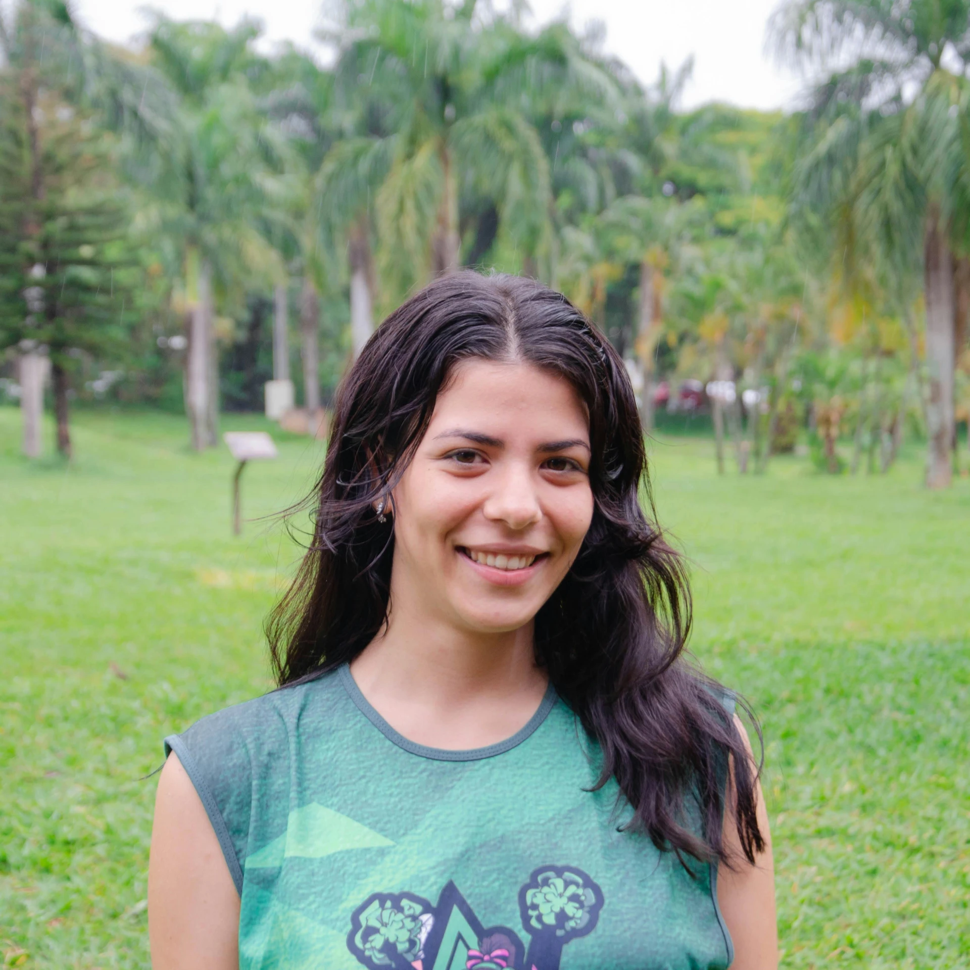 a girl in a park posing for the camera