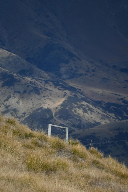 the back side of a man standing on top of a hill