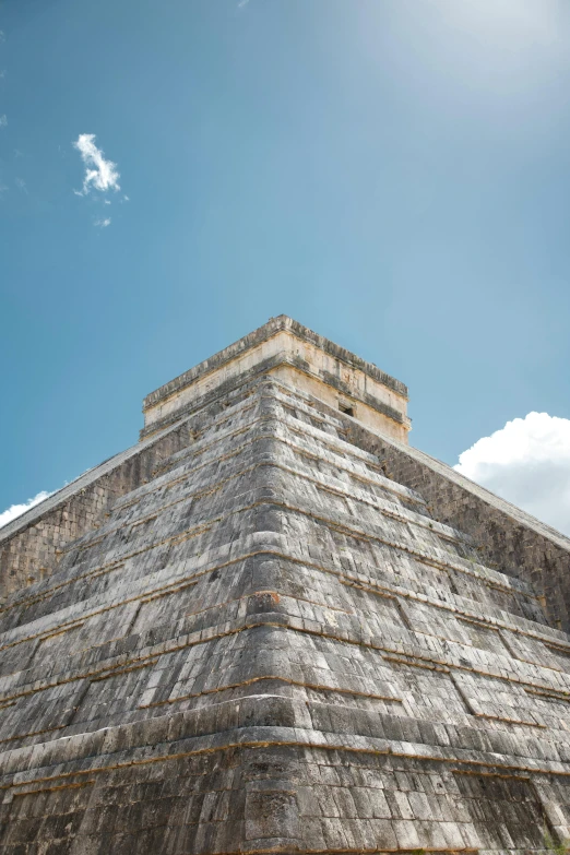 a stone pyramid with a sky background