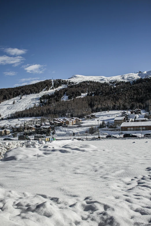 a hill with a snow board on the bottom of it