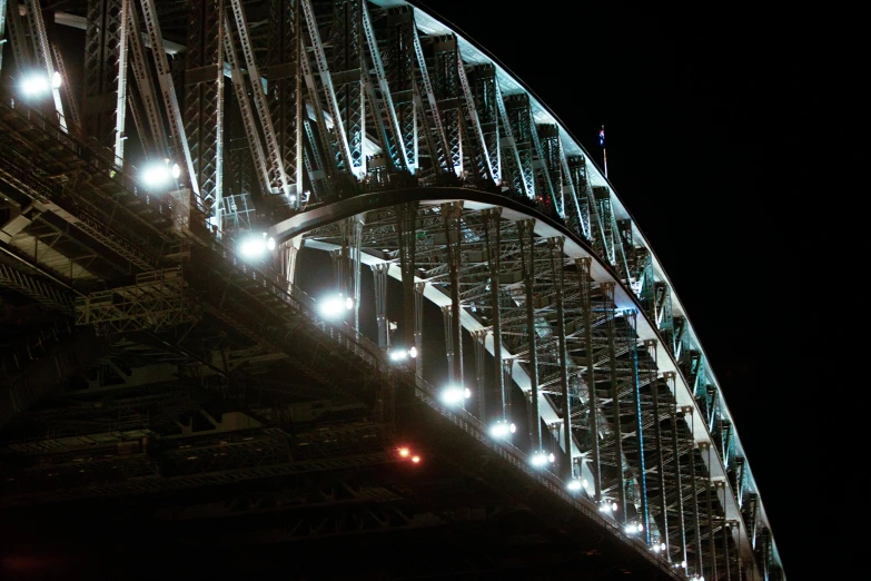 a large bridge with lots of lights above it