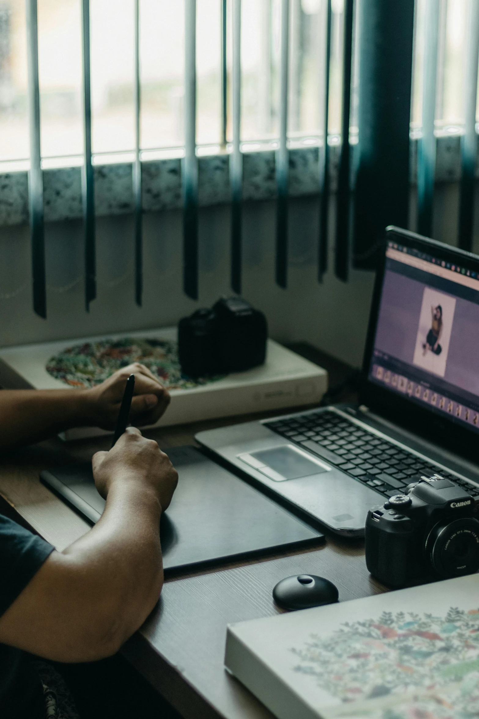 a man sitting in front of a laptop computer