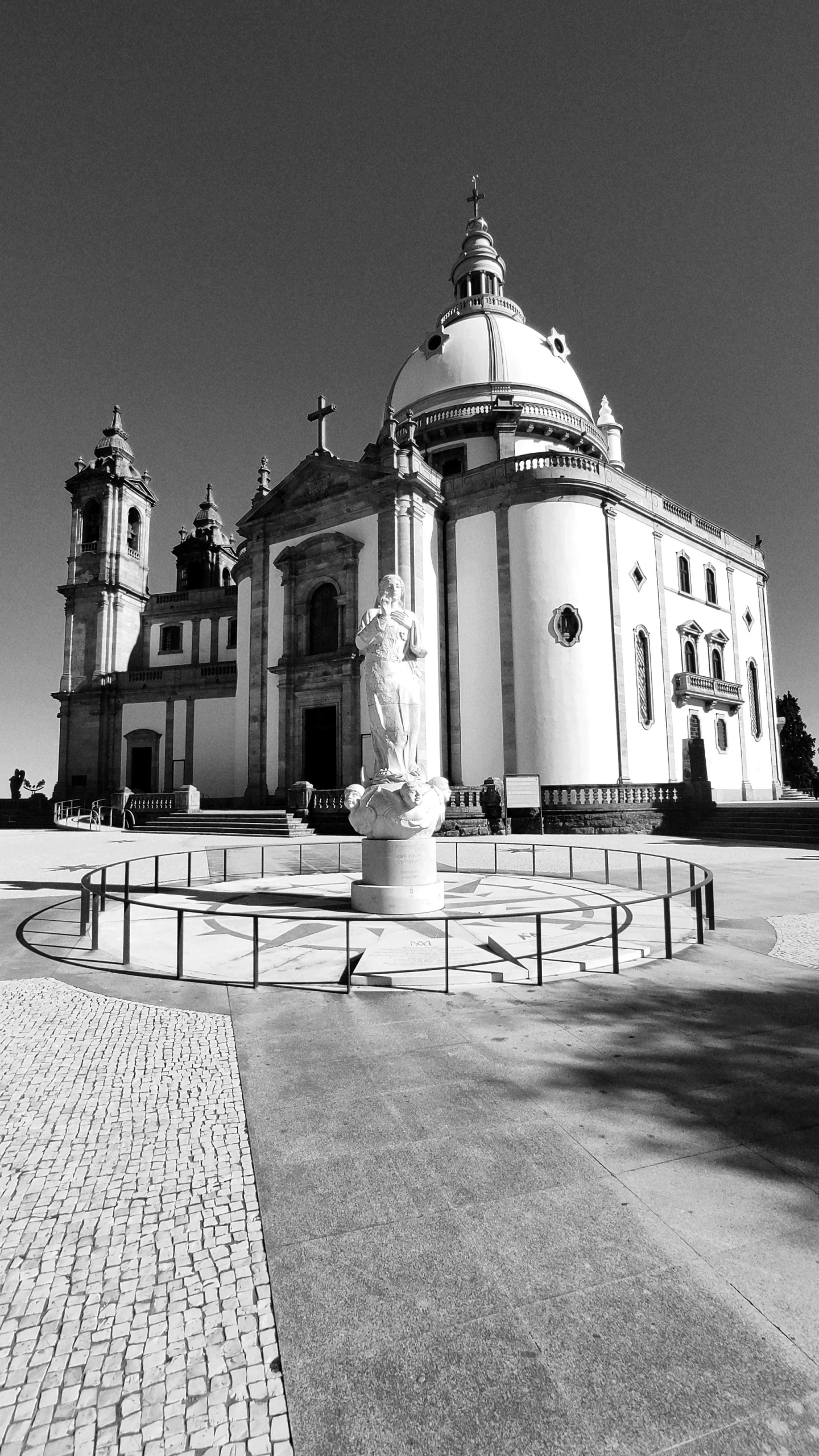 a black and white pograph of a building with a clock tower