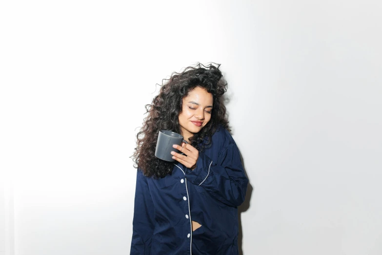 a woman in blue shirt looking at her cellphone