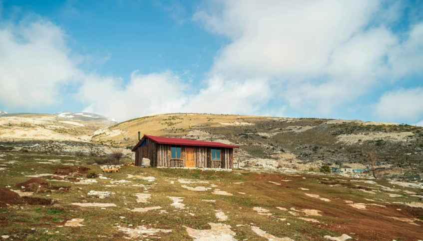 a small shack in an open field