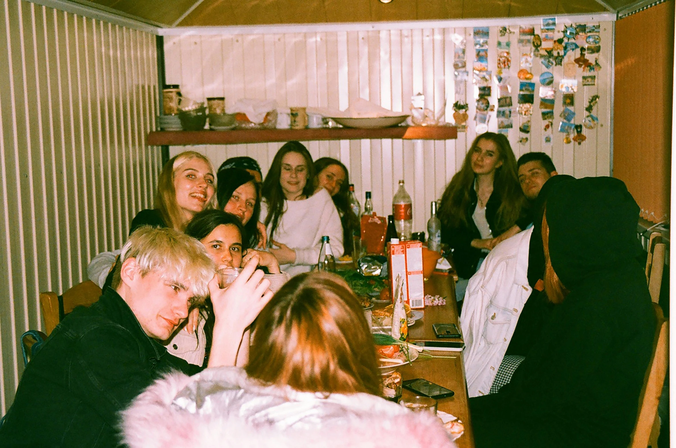 a group of women sitting around a dining room table