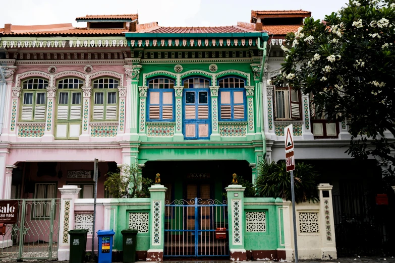 a house in the middle of a neighborhood on the street