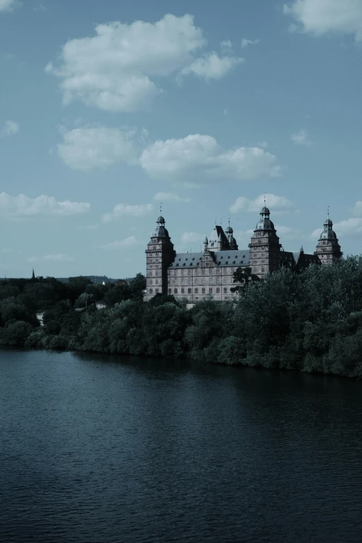 an old castle standing beside a body of water