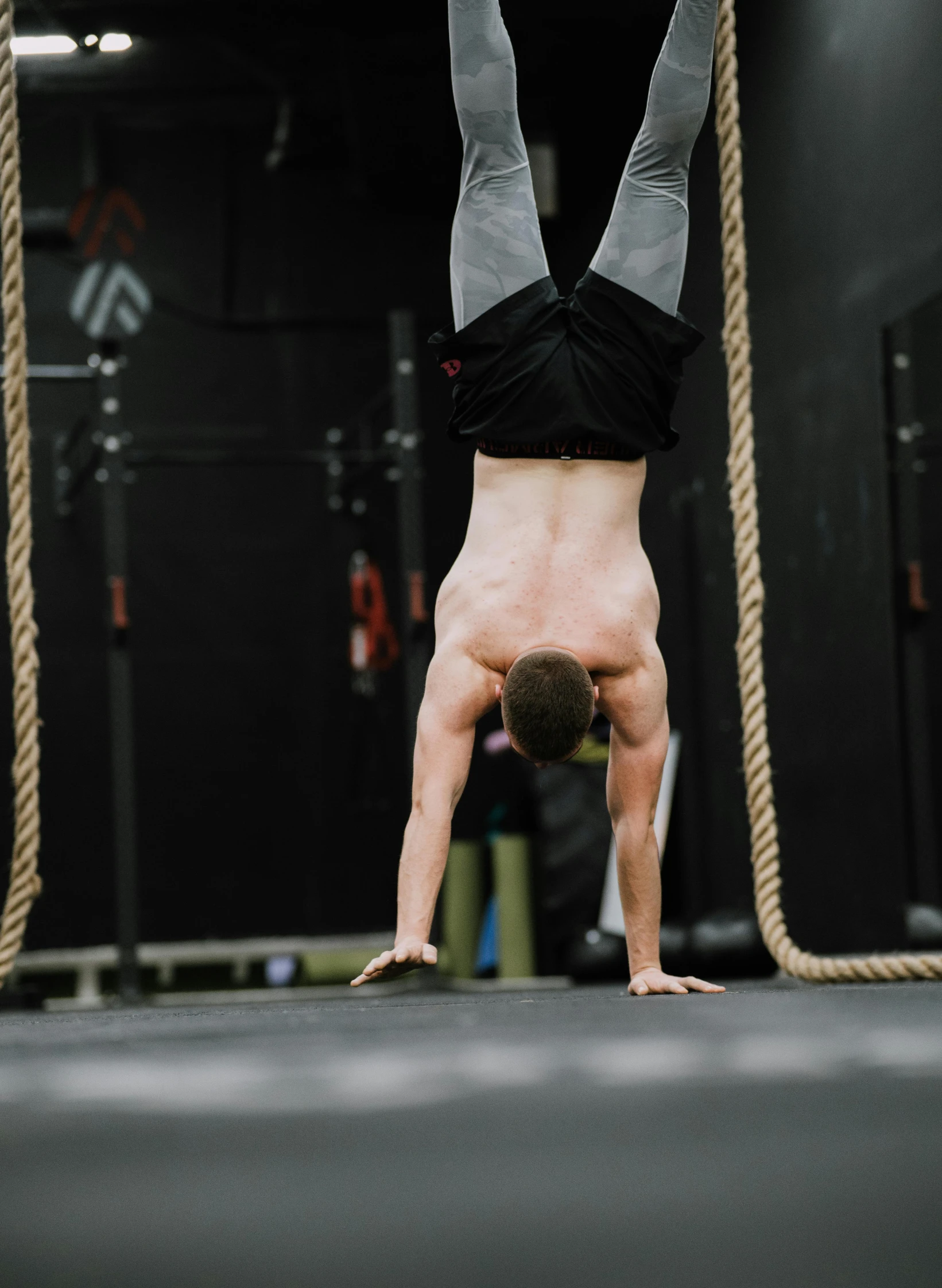 a man is doing some hand stand exercises