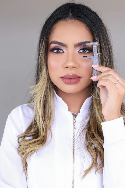 a woman holding an open cell phone to her face