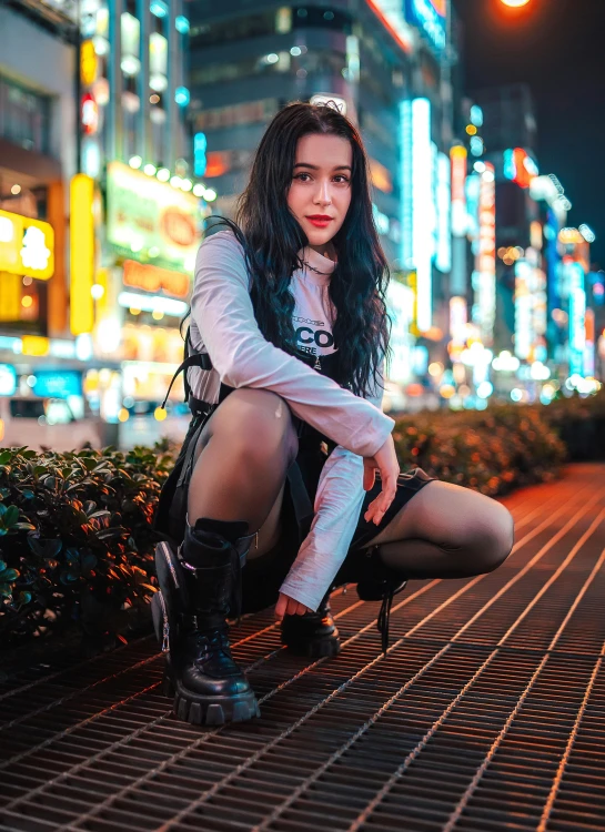 a young woman posing in an asian city