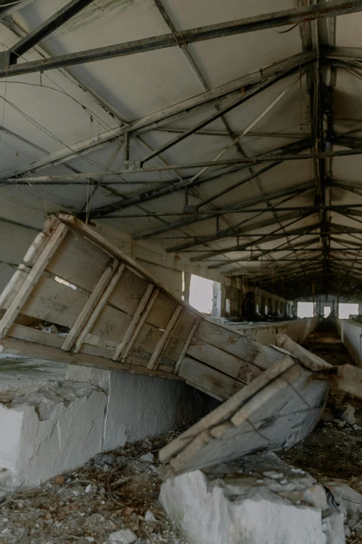 an old, run down building with rust and rubble in the foreground